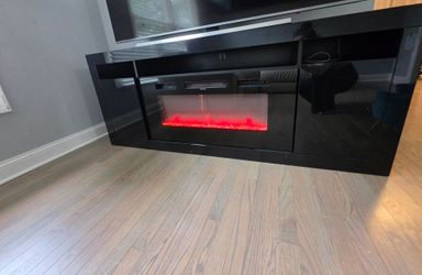 Selling my Modern Black TV Stand with Electric Fireplace + Matching Wall Cabinet. Very good condition. Price 600$