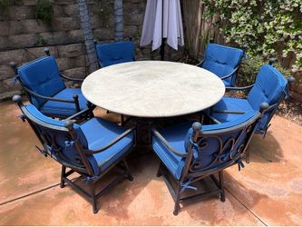 Wrought iron & concrete table with 6 swivel chairs