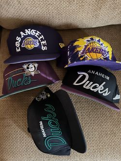 Laker/ mighty ducks caps.   Take all for 30 bucks.