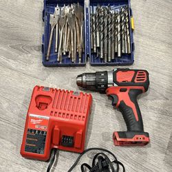 Milwaukee M18 Drill And Charger + a lot of drill bits $60 Firm Pick Up Only
