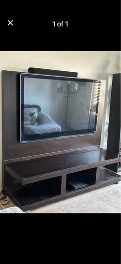 Tv stand with flat screen tv.