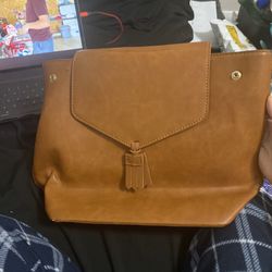 Brown faux leather bag, unbranded. 