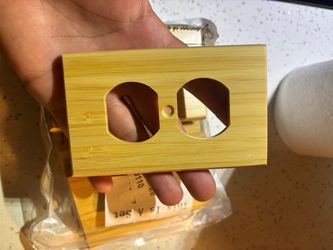 Stylish bamboo outlet cover for home decor.