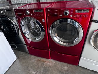 Red front LG washer and front load LG dryer electric high efficiency with pedestals