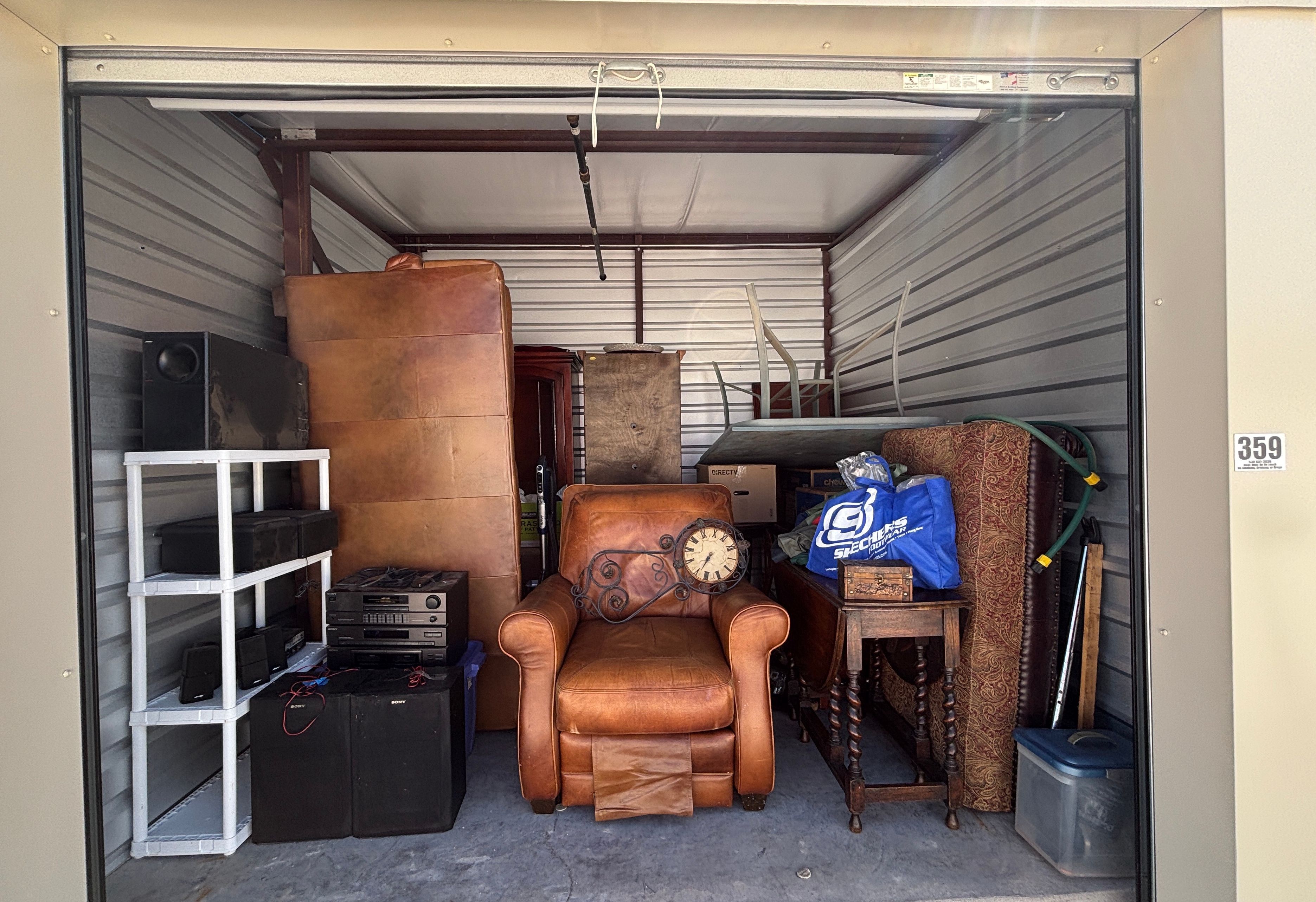 Auction Unit 359 6/26- Couch, Clocks, Stereo, Otterman, Table, Shelf Unit, Entertainment System,