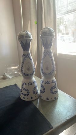 Empty Clase Azul Reposado tequila bottles.