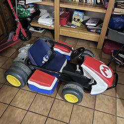 For Sale: Mario Kart Ride-On Car – $250 	•	Excellent condition, fun for kids 	•	Battery-powered, works perfectly 	•	Includes all original parts and ac