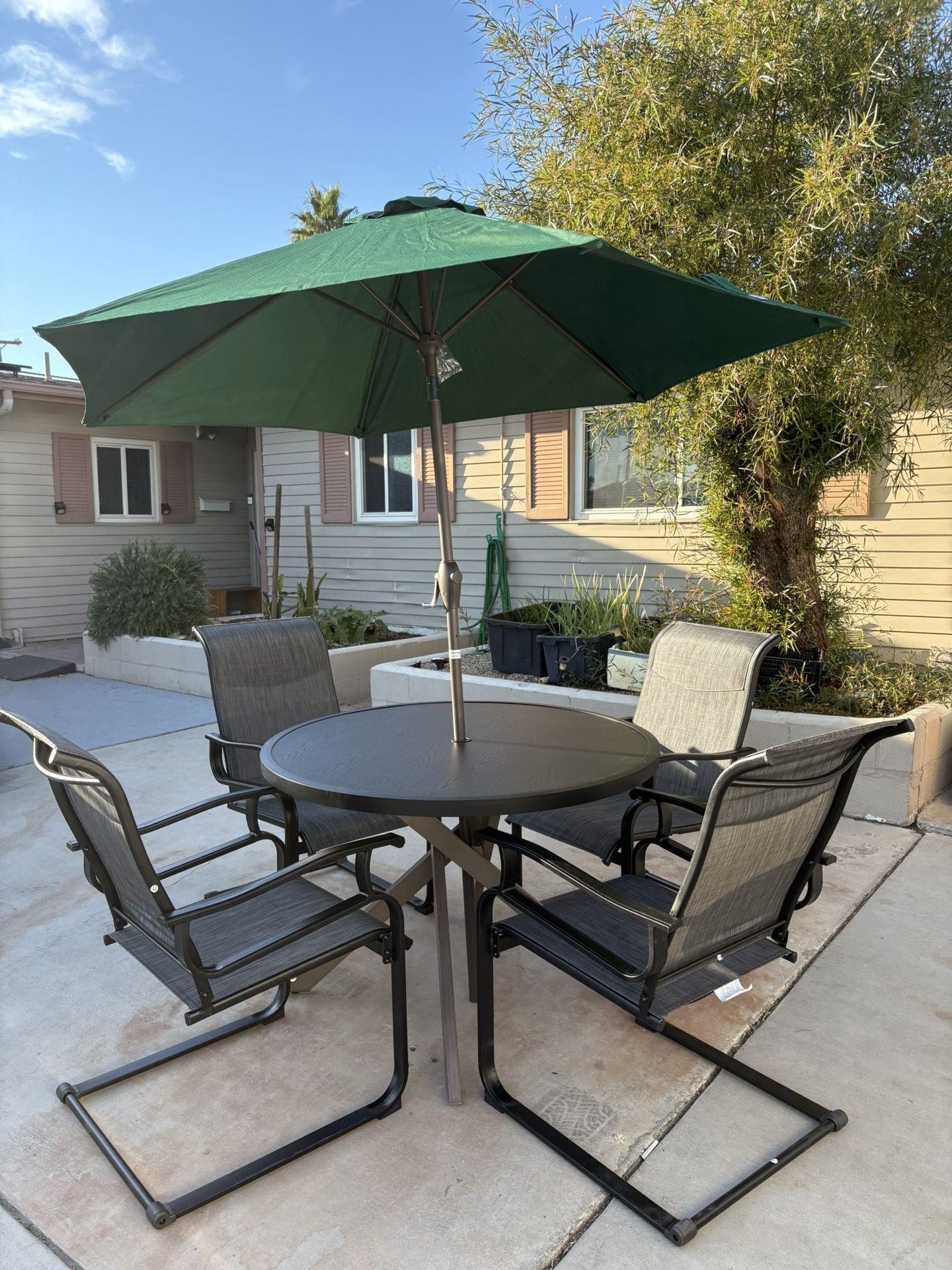 Outdoor tables, chairs and sun umbrellas