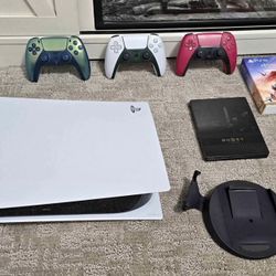 PS5 with controller and games