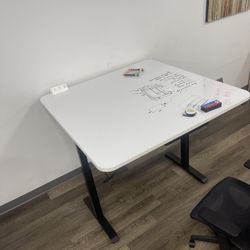New Electric Sit/ Stand Desk with 4’x4’ Whiteboard Top Outlet Module And Pencil Drawer