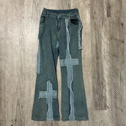 Blue patchwork flare jeans with crosses