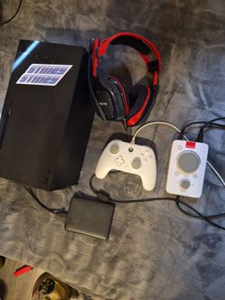 Xbox Series X with controller, headphone, and extra storage