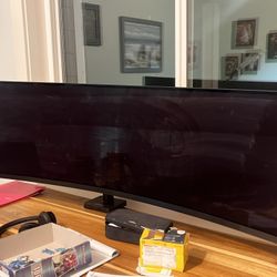 MSI 49 inch curved gaming monitor with desk attachment stand