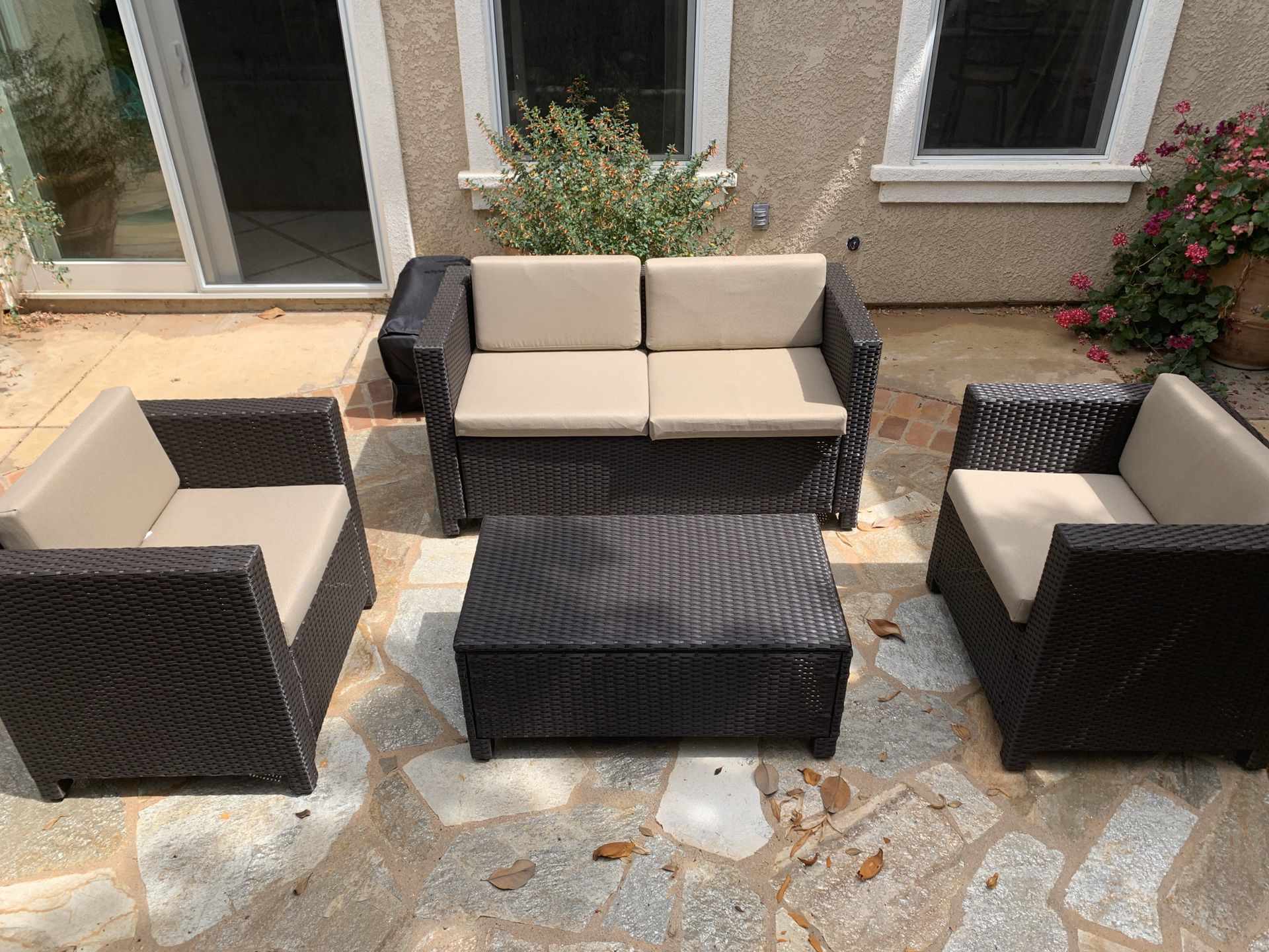 New, just assembled 4 piece Rattan Sofa seating group with cushions
