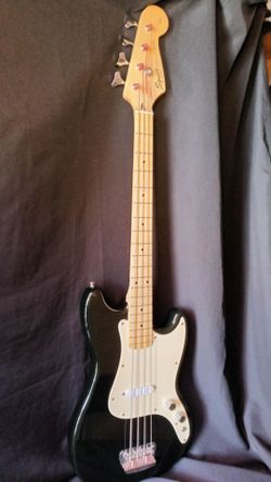 Squier by Fender electric bass