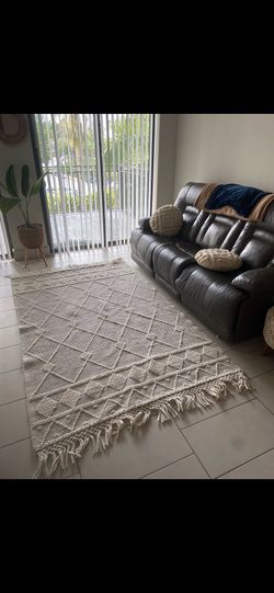 Sofa, flower pot, wall decor TV