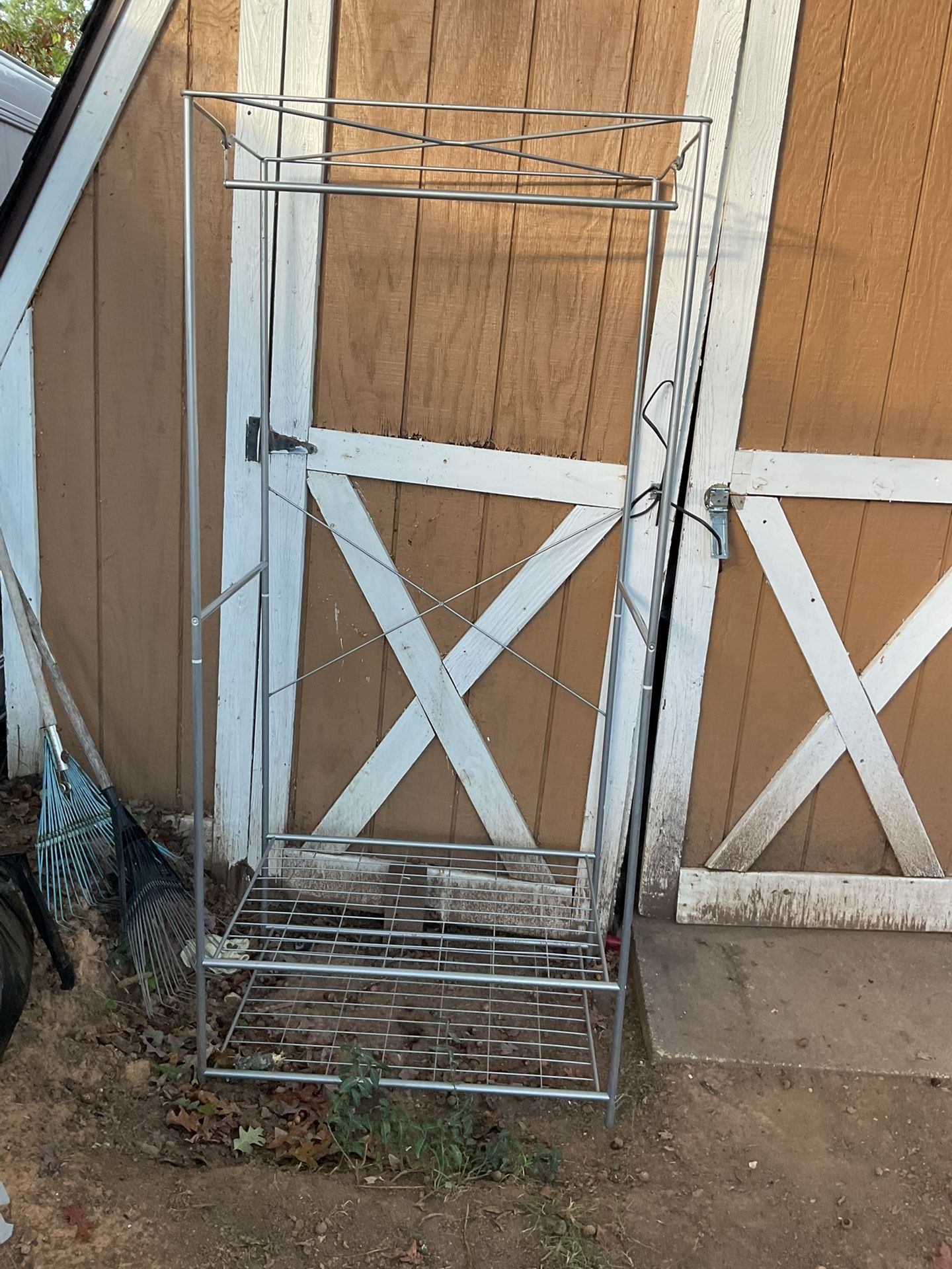 A Big, Tall Clothes Rack With Shelves In The Bottom (70” Tall X 32” Long X 22” Wide)