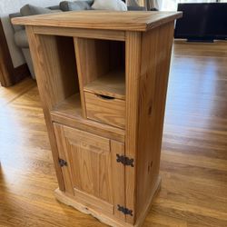 Rustic solid wood accent cabinet in a warm natural finish.