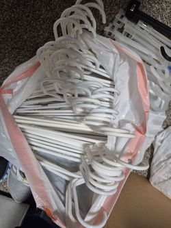 WHITE PLASTIC HANGERS