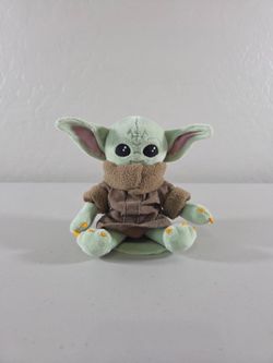 Grogu from Madalorian. Shoulder magnet buddy. From Disney World