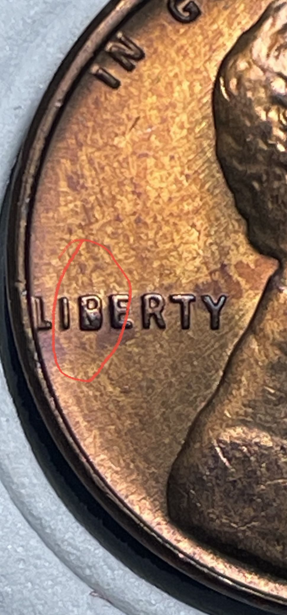 1957-D Lincoln Penny - Extra metal (error on the letter( B )