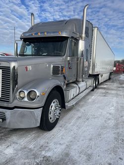 2014 Freightliner Coronado & 2015 Utility Trailer