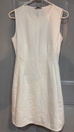 Cream Sleeveless Mini Dress, Size small but fits like a medium.