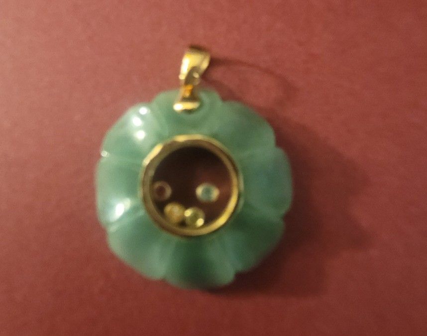 Pendant 14k Jade With tiny Stones in the middle.
