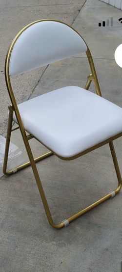 White padded folding chairs