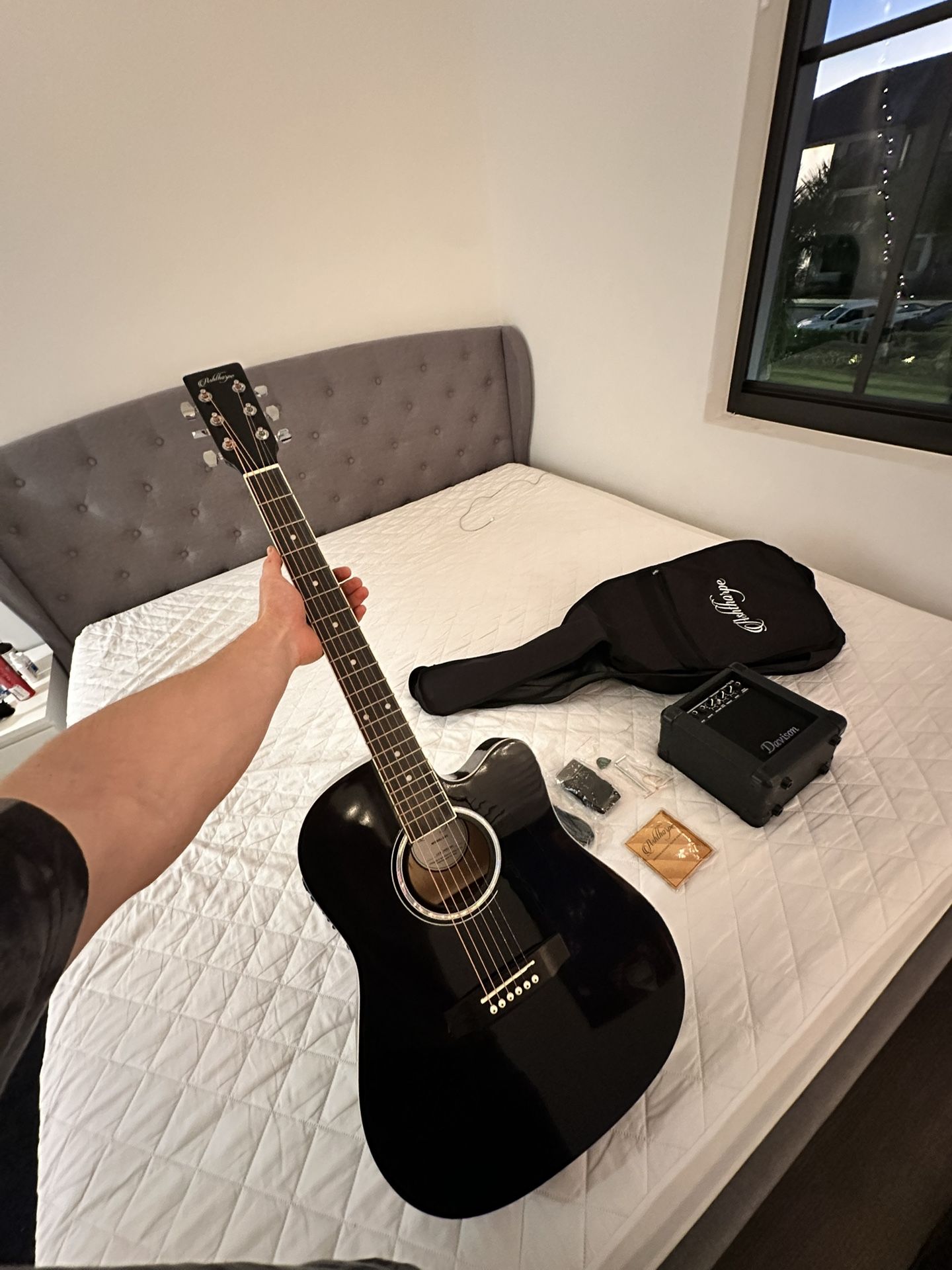 Guitar with amplifier and full set of new strings