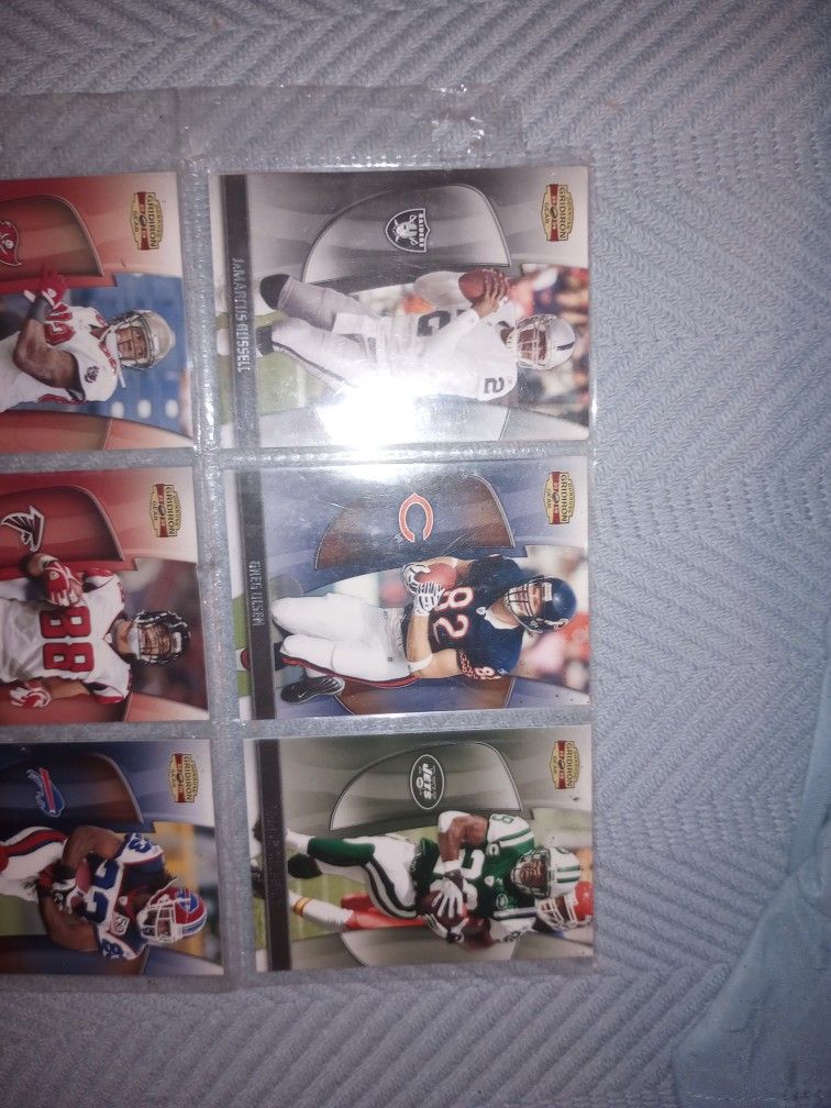 collectible foot ball cards still in the plastic 