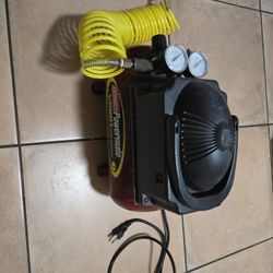 Coleman Powermate VP201 air compressor w/ yellow coiled hose