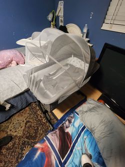 Bassinet with baby feeding chair included.
