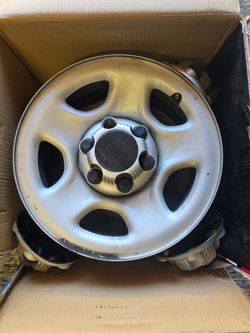 Oem Chevy rims and center caps all 4