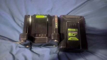 Greenworks pro Ultra power 60v lithium ion 5.0 battery and charging port.