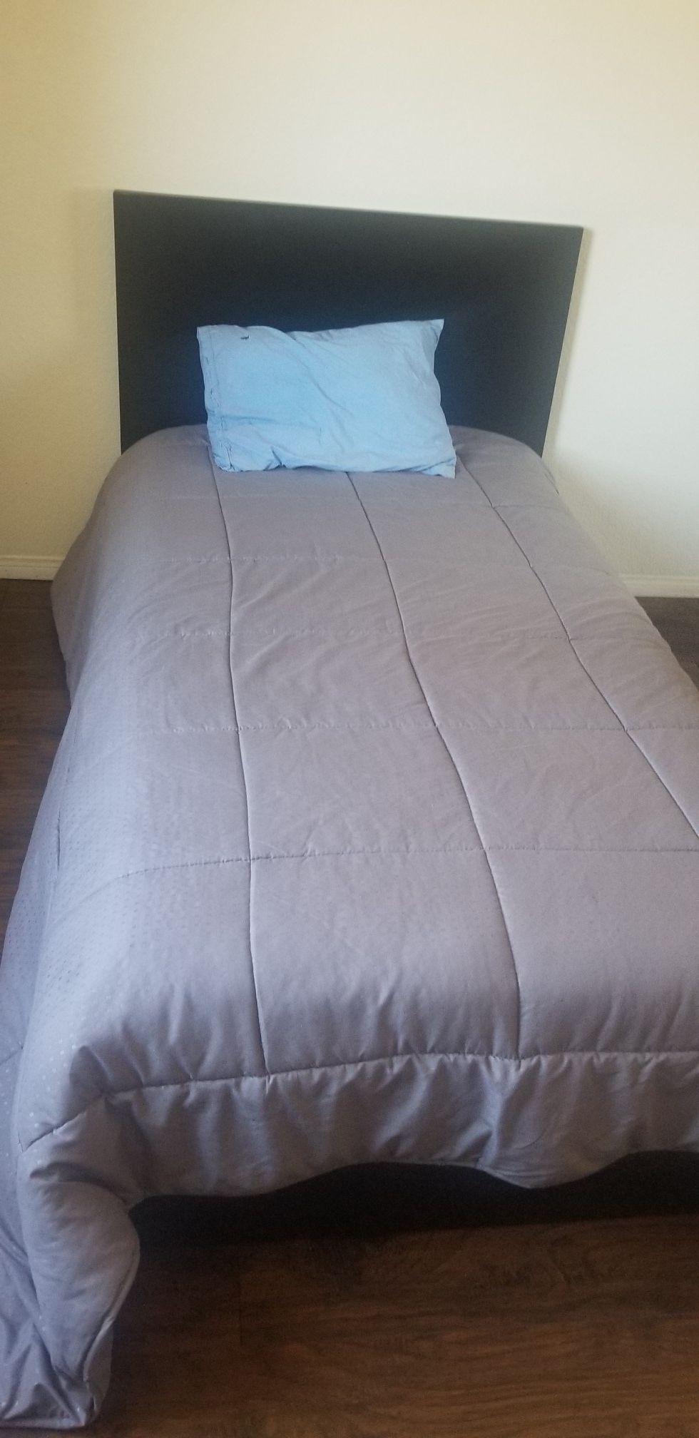 twin bed..complete with mattress and headboard
