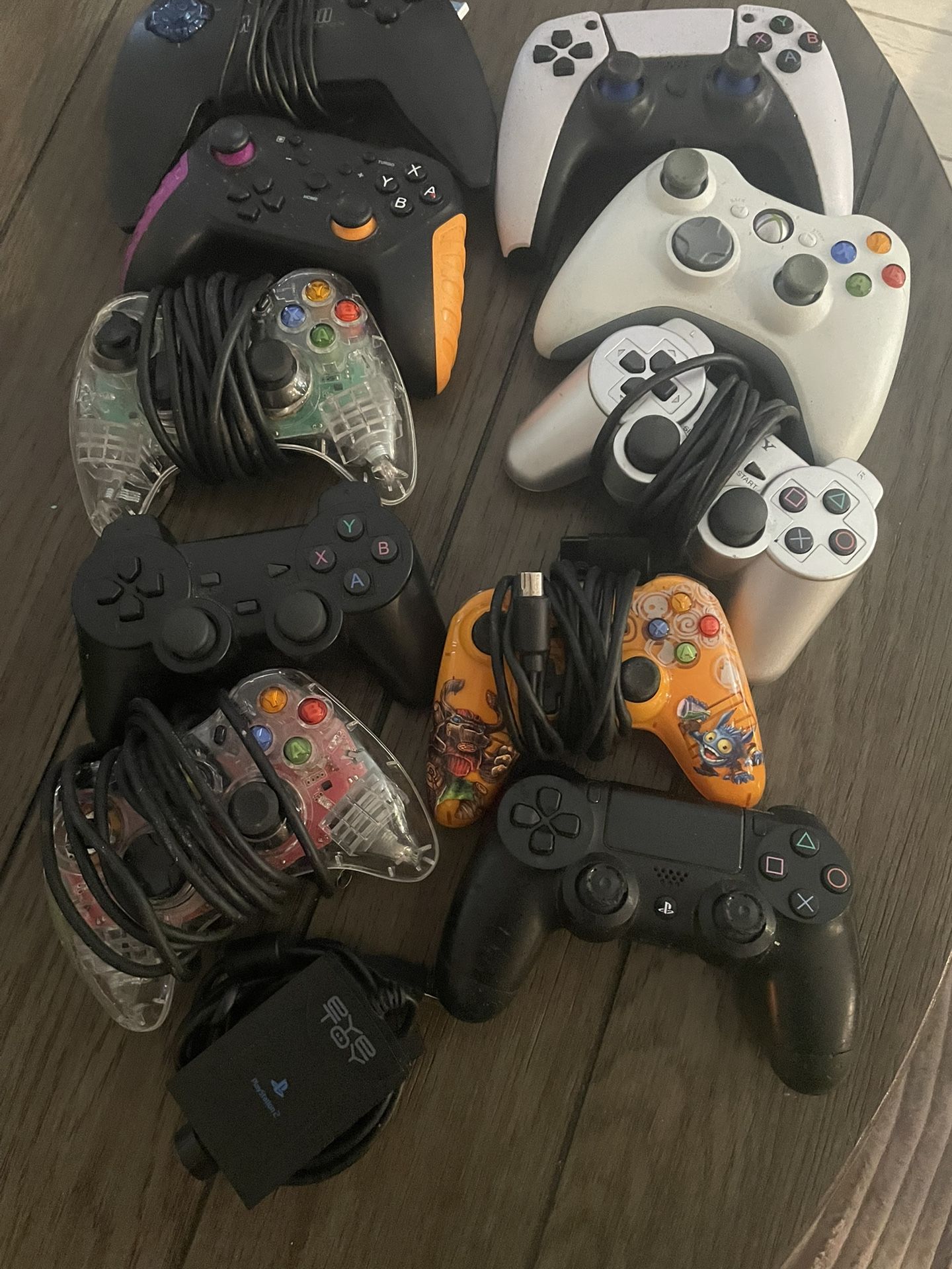 10. Random Controllers For Xbox And Playstation With A Playstation I Toy Camera.