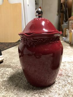 Red ceramic jar with lid