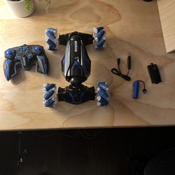Blue and black remote control car with rechargeable battery comes with charger wheels allow it to go from side to side