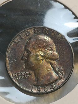 #725 Toned 1964 Quarter coin