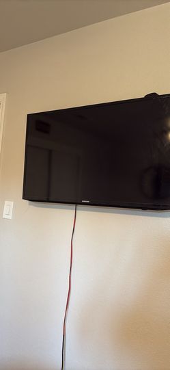 Flat screen with Roku hook up and remotes wall mount