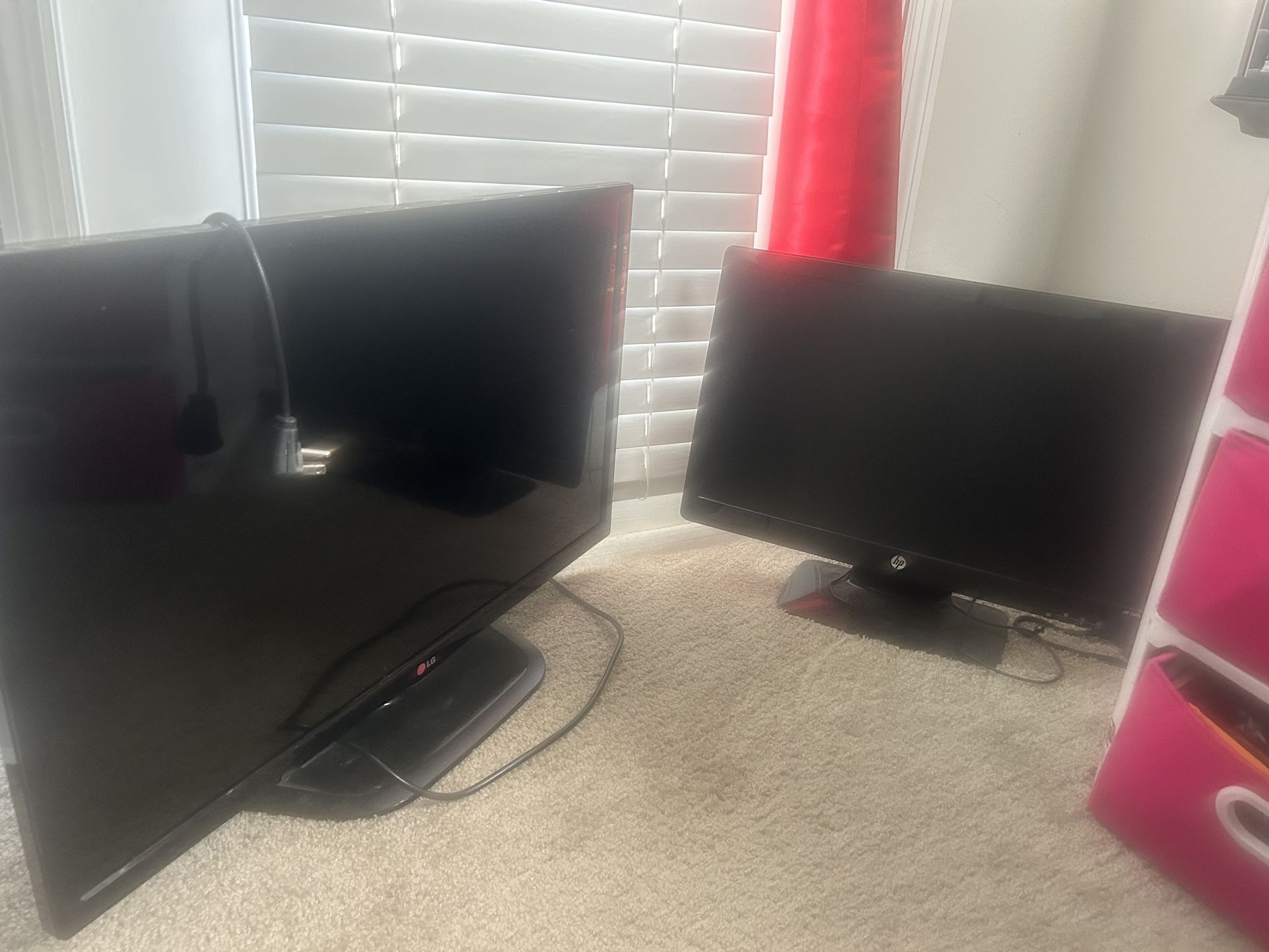 TV And Two Computer Monitors 