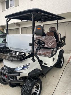 White 4 seater golf cart