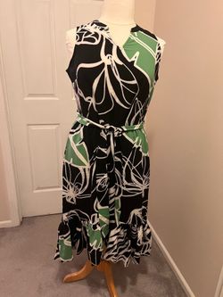 New. Black and green dress with floral design, size:L $25 cash only. Cross posted