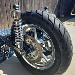 Swing arm with rear tire HD Michelin 150/80B16 adj shocks belt pully guard brake caliper rotor rear fender exhaust bracket sportsters great shape $400