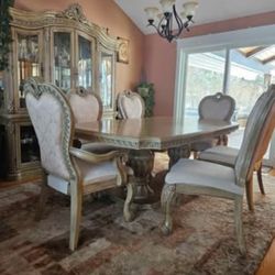 Dining table set with 6 chairs and china cabinet. Table  extends with two leafs. 