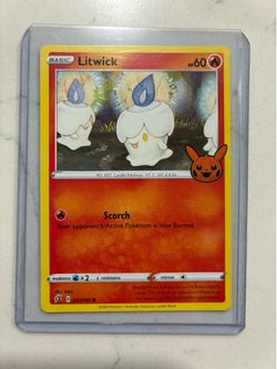 Litwick Pokémon card in sleeve.