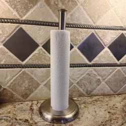 NEW IN BOX. VERY NICE & HEAVY PAPER TOWEL 🧻 HOLDER. You Don't Have Worry About Pulling A Piece Off & It Falling Over. See Photos. Cash& Pickup Only