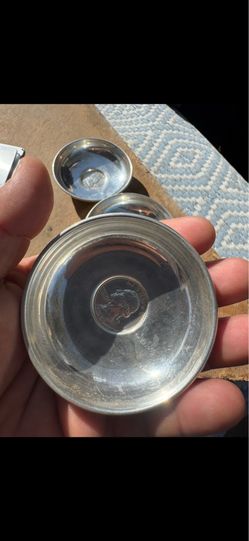 silver plates with a coin very old