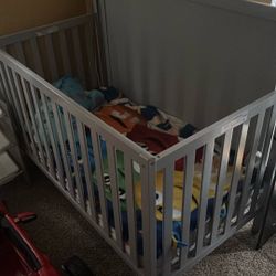 Crib And Mattress (mattress covered)